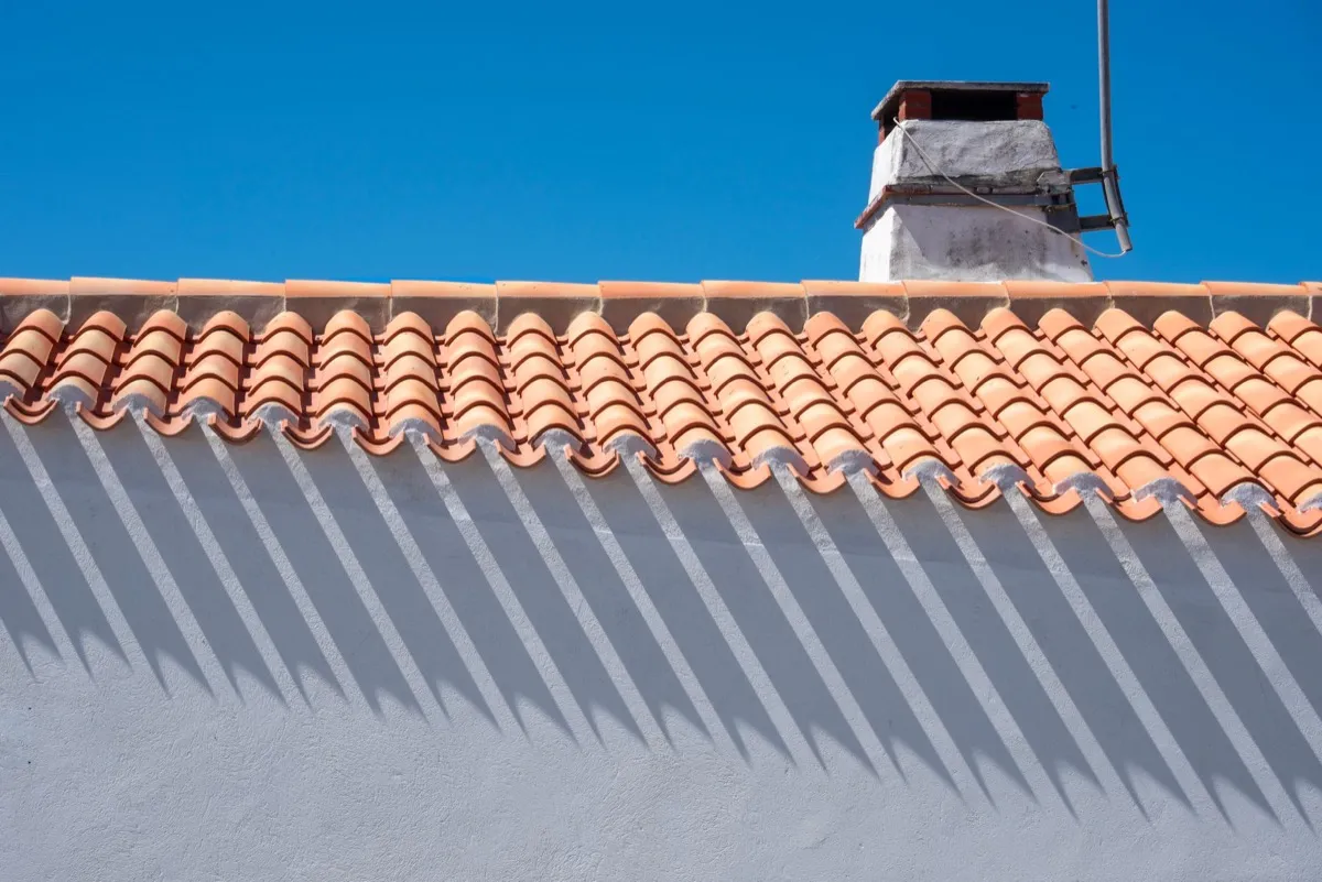 Roof ridge line and chimney on a home in Baytown, TX