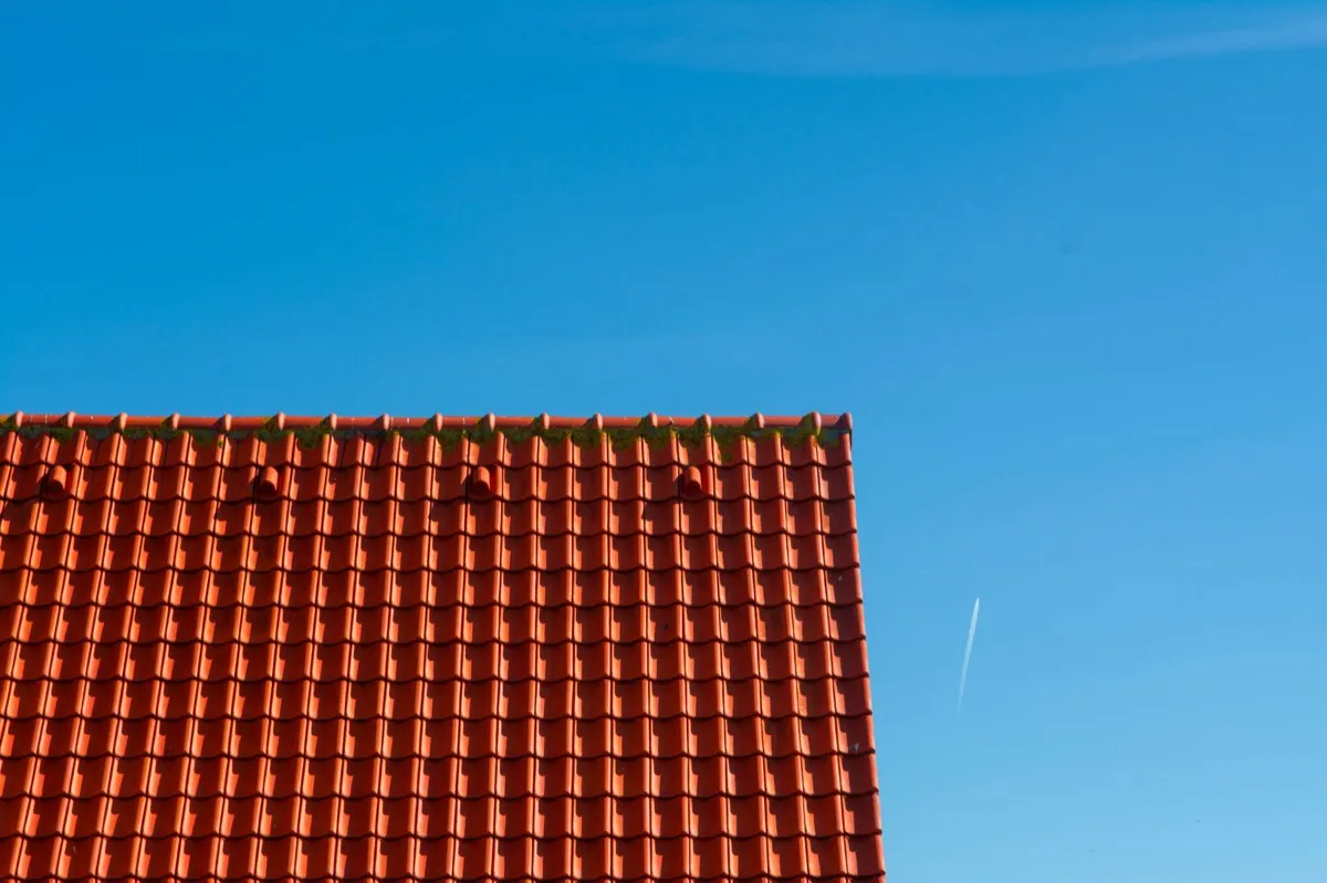 Tile roof gable in full sun, the kind of exposure that sets roof life in Baytown, TX